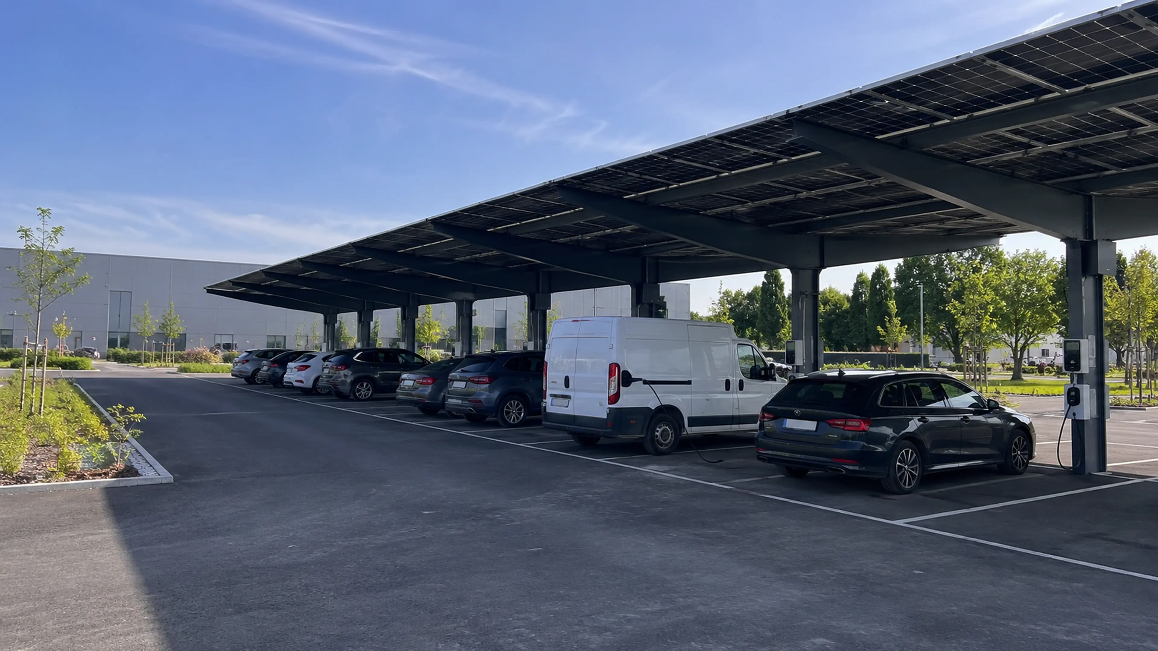 Large commercial solar carport with charging spaces for electric vehicles